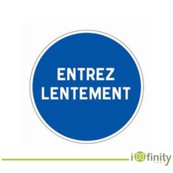 Blue circle reads Entrez lentement sign