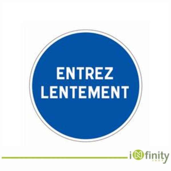 Blue circle reads Entrez lentement sign Blue circle reads Entrez lentement sign